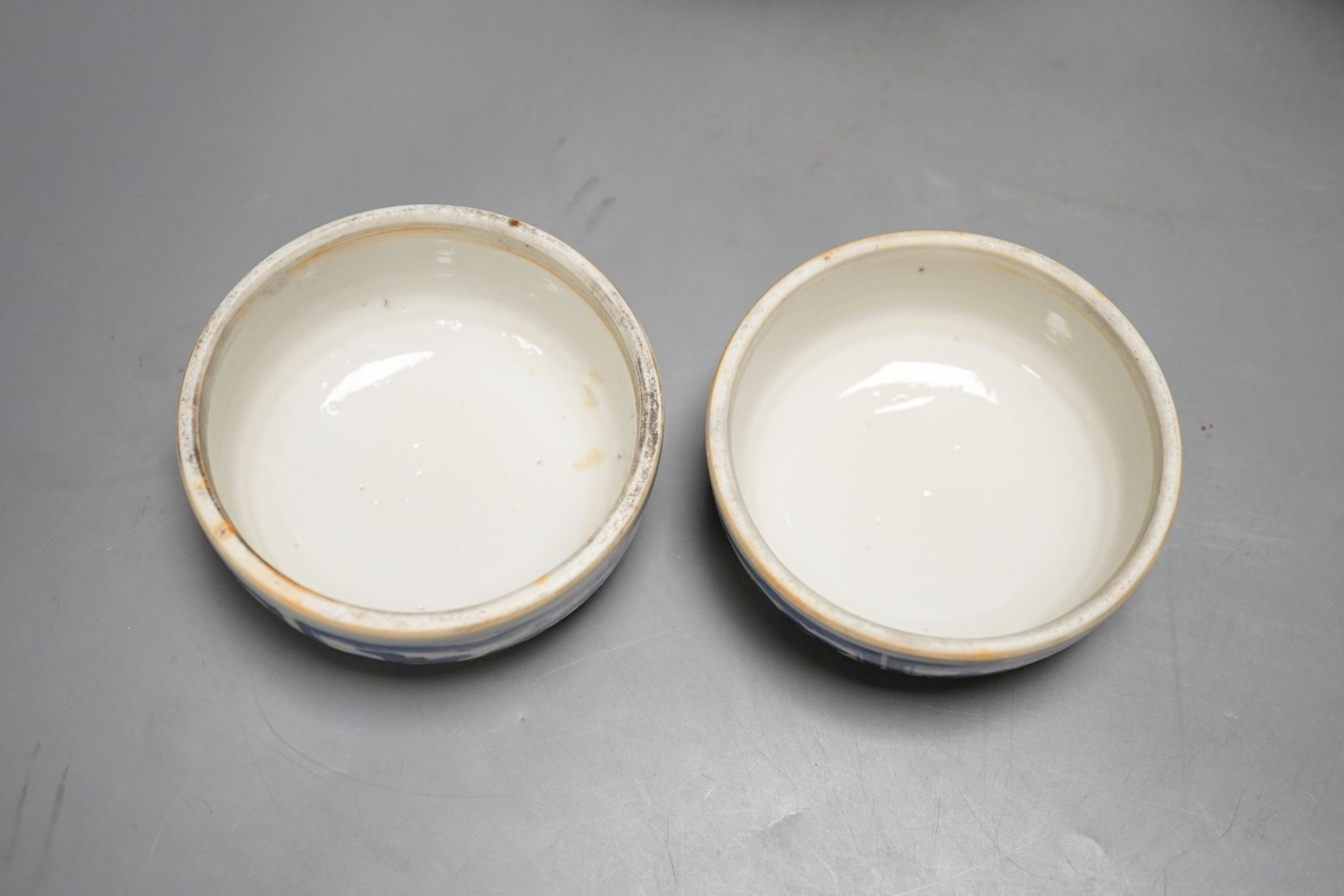 A pair of Chinese blue and white ginger jars and covers, 22cm, On stands